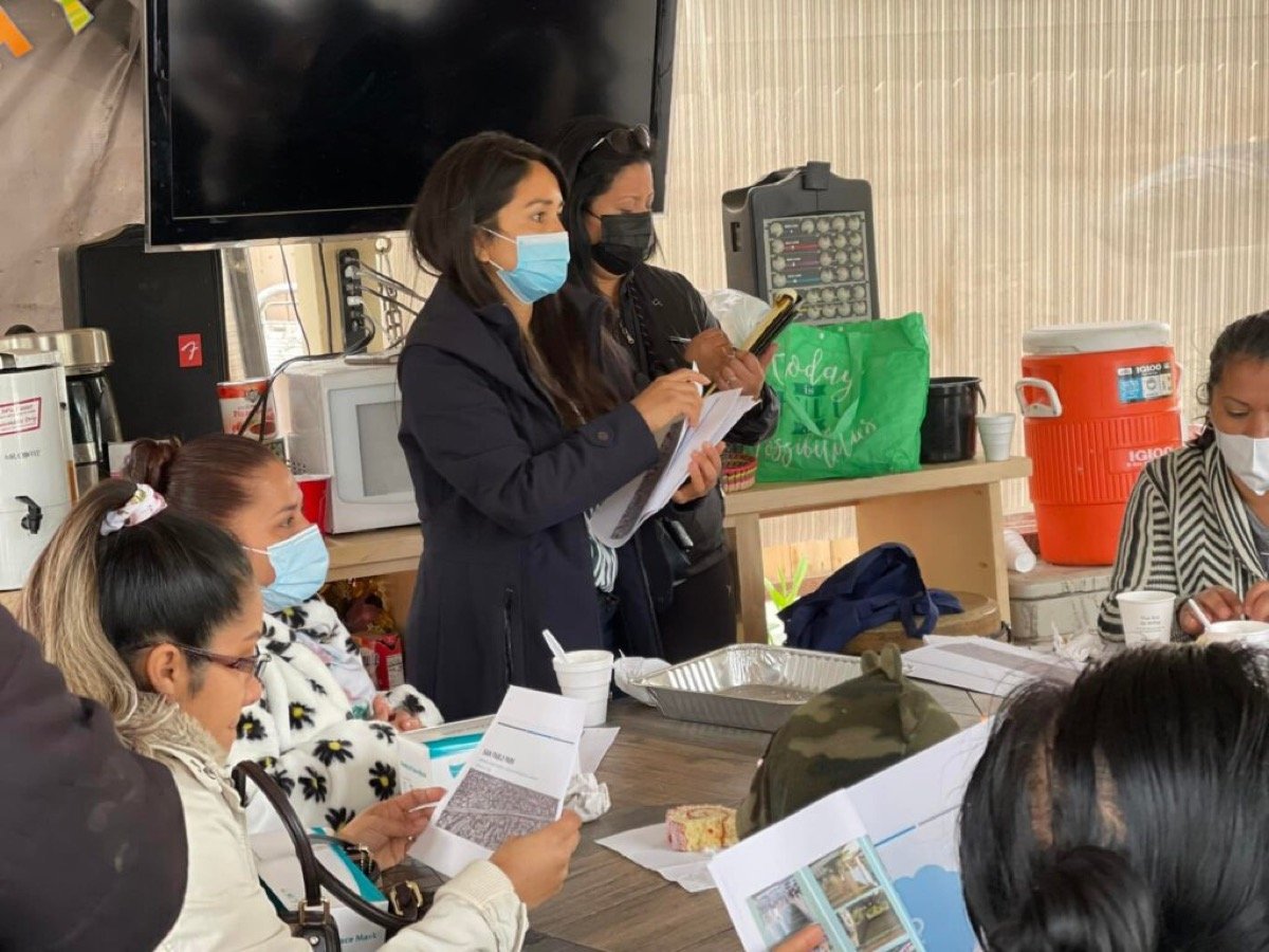 Ariana reviewing community plans with neighbors at a South Fresno community meeting